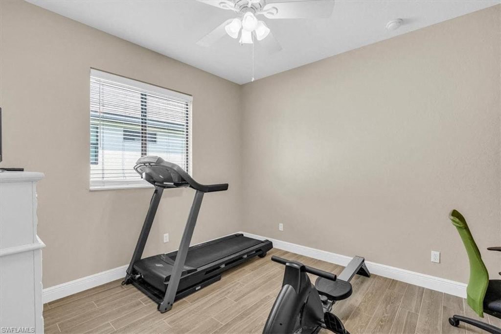 the gym in the home has a treadmill and a window