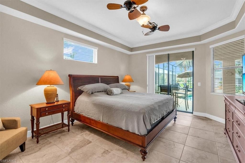 a bedroom with a bed and a ceiling fan