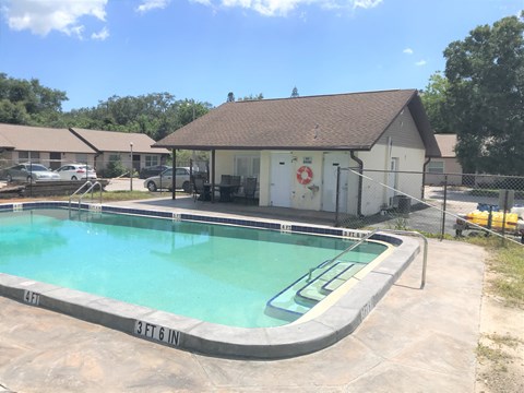 a swimming pool in front of a house