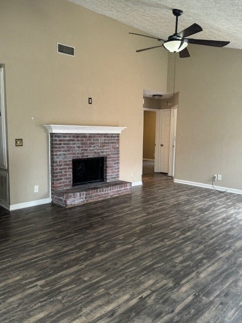 a living room with a fireplace and a ceiling fan