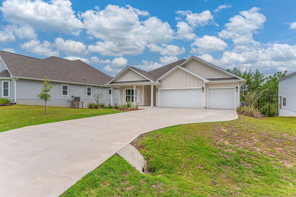 a house with a driveway and a garage door