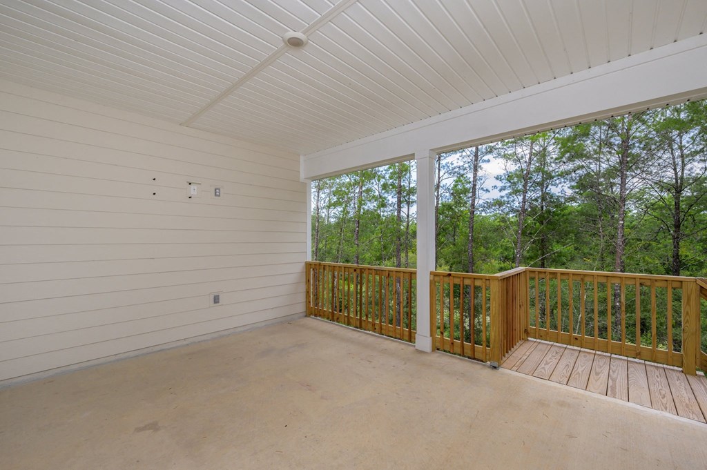 the screened porch has a view of the woods