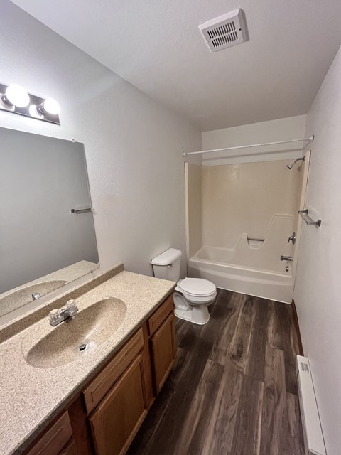 an empty bathroom with a sink and a toilet