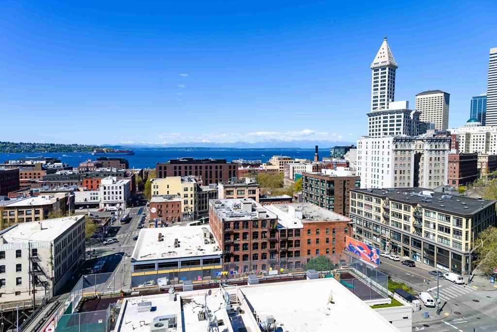 A cityscape with a clear blue sky above.