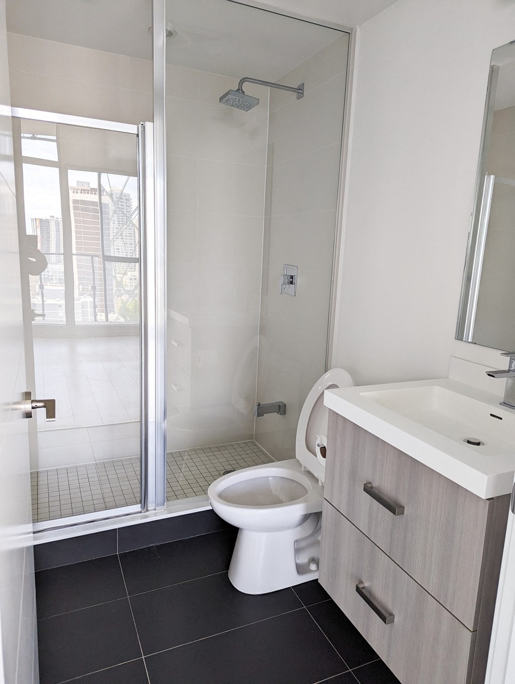 an empty bathroom with a toilet and a shower