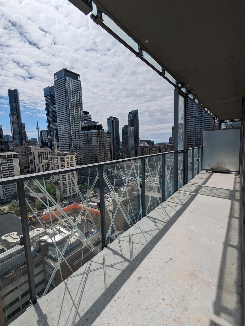a view of the city from the balcony of a building on a roof