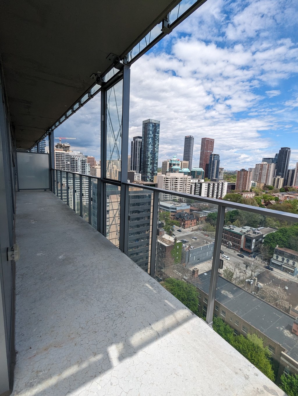 a view of the city from the balcony of a building