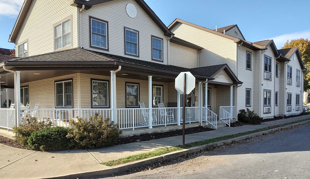a house with a stop sign in front of it