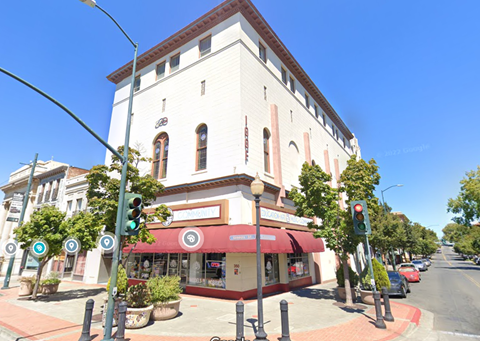 a building on the corner of a city street
