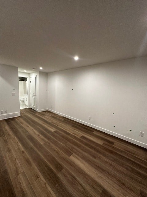 a living room with wood floors and white walls