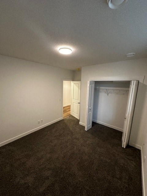 an empty room with a closet and a door open