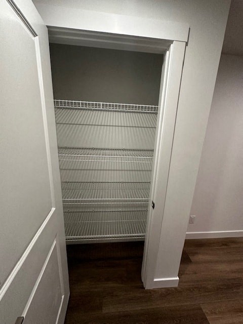 an empty closet with a door open