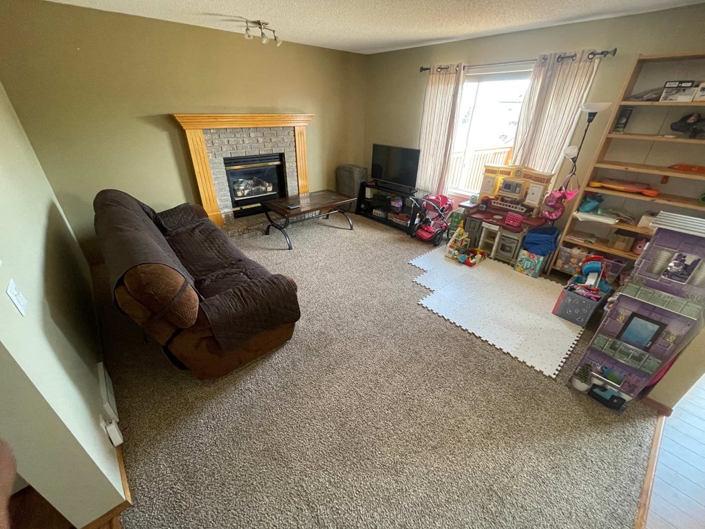 an overhead view of a living room with a couch and a fireplace