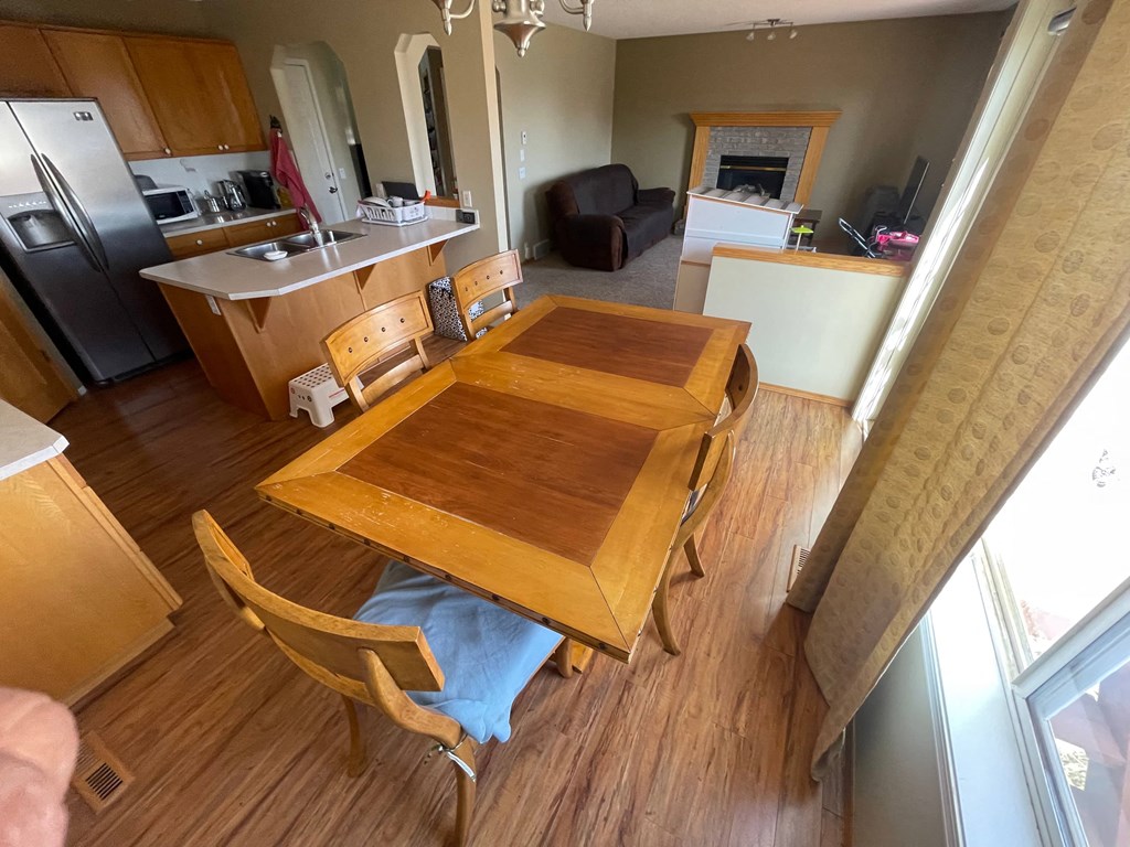 an aerial view of a dining room table and a kitchen