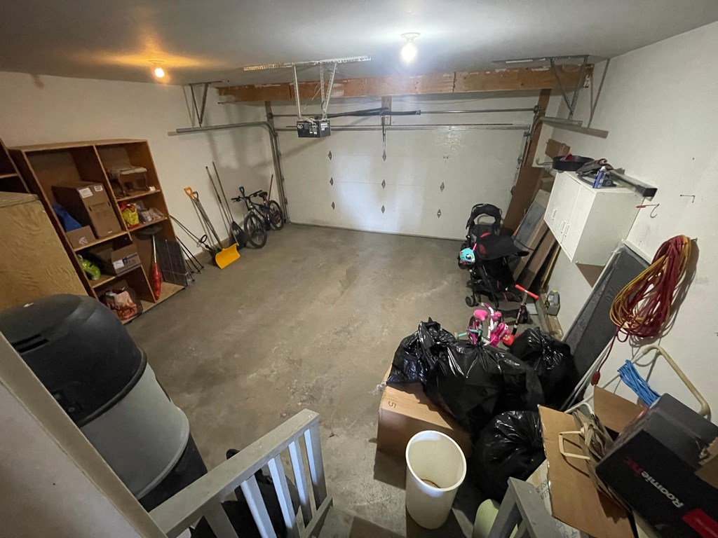 a cluttered garage with a lot of items in it