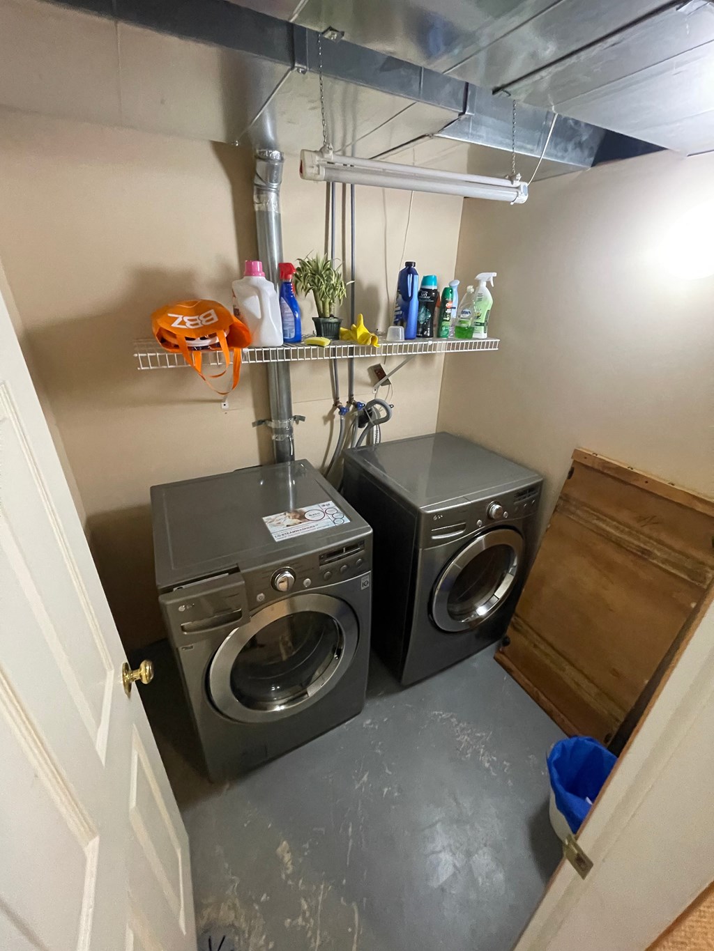 a small laundry room with a washing machine and a dryer