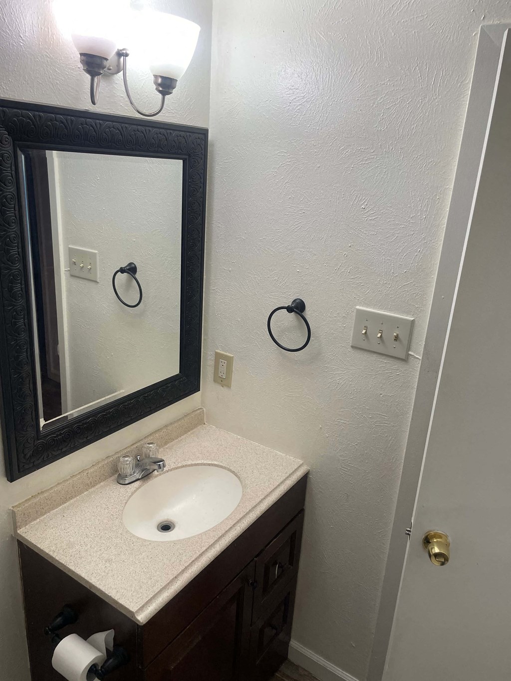 a small bathroom with a sink and a mirror