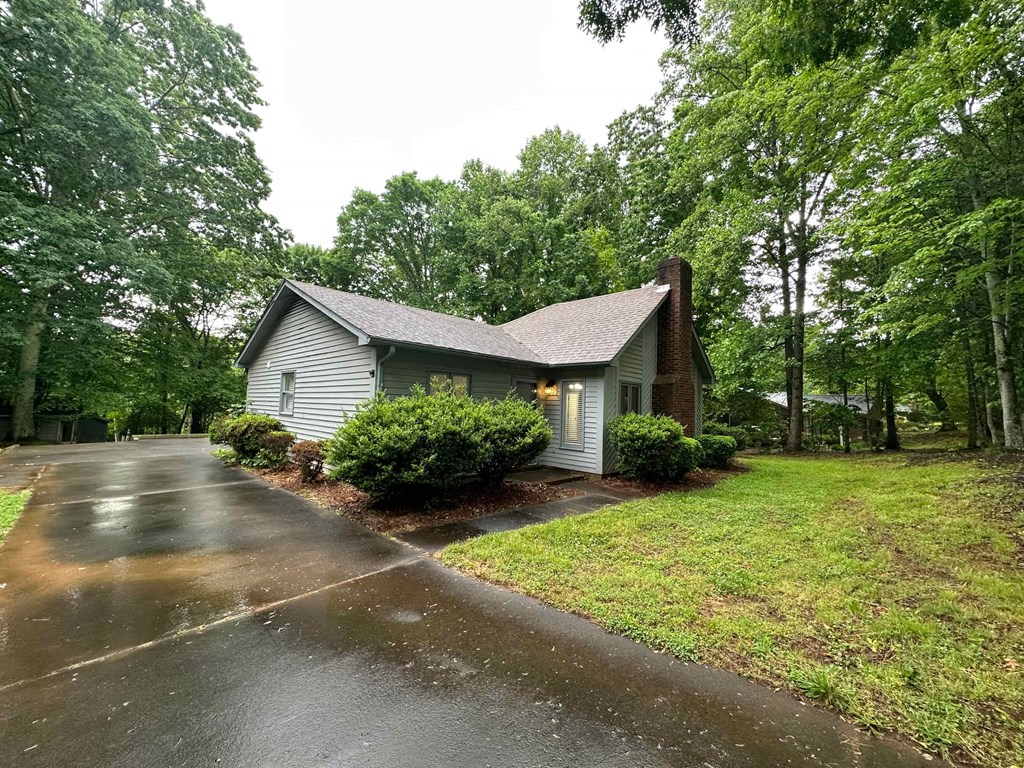 a house on a rainy day on a wet street