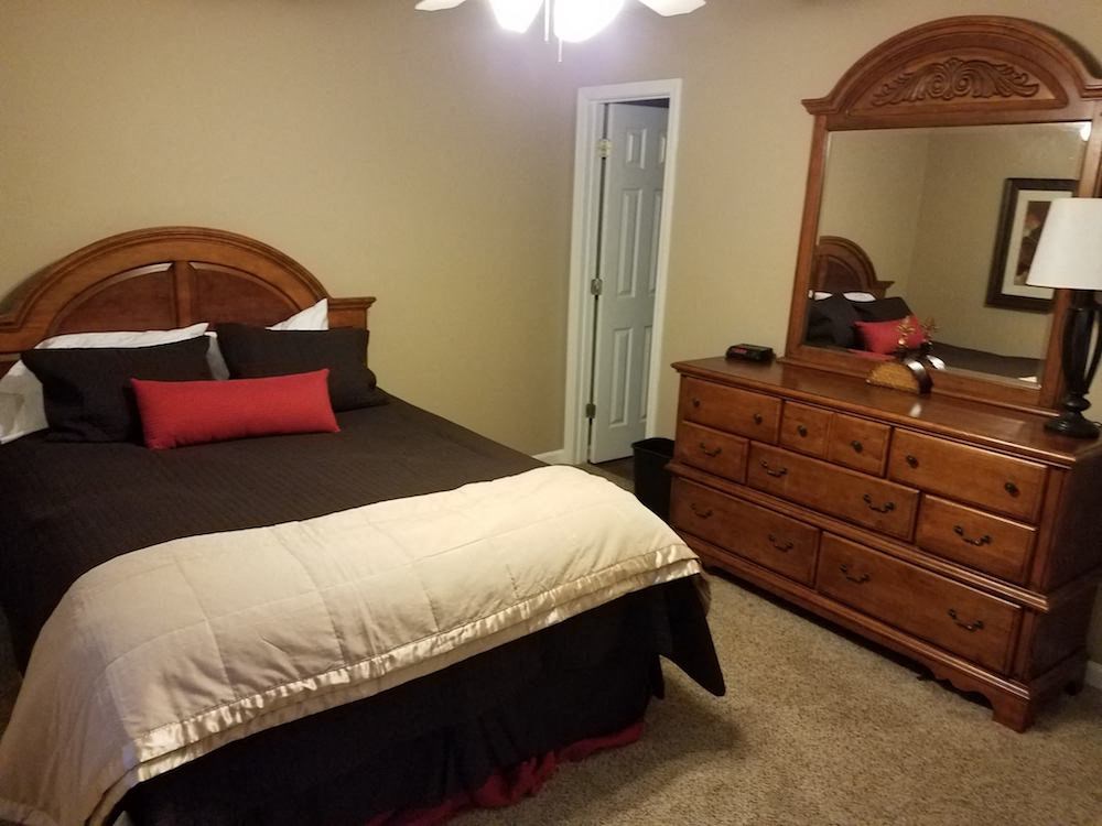 model bedroom with bed and dresser