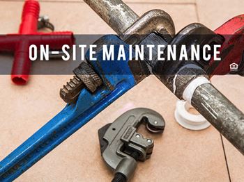 pipe wrenches clamped onto pipe