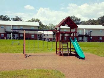 childrens playground with swings and slide