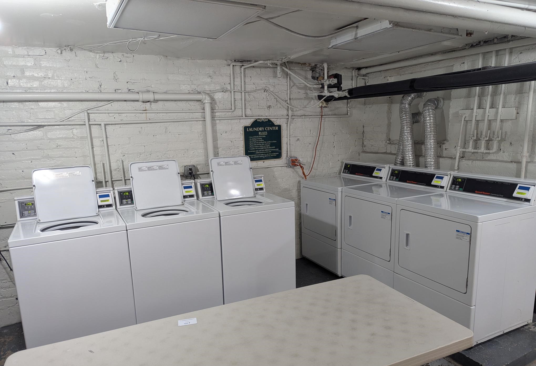 A row of washing machines in a laundromat.