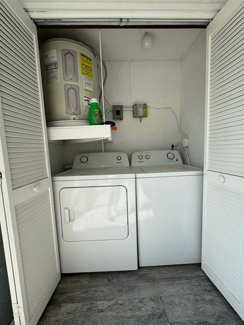 a laundry room with two washes and a dryer in it