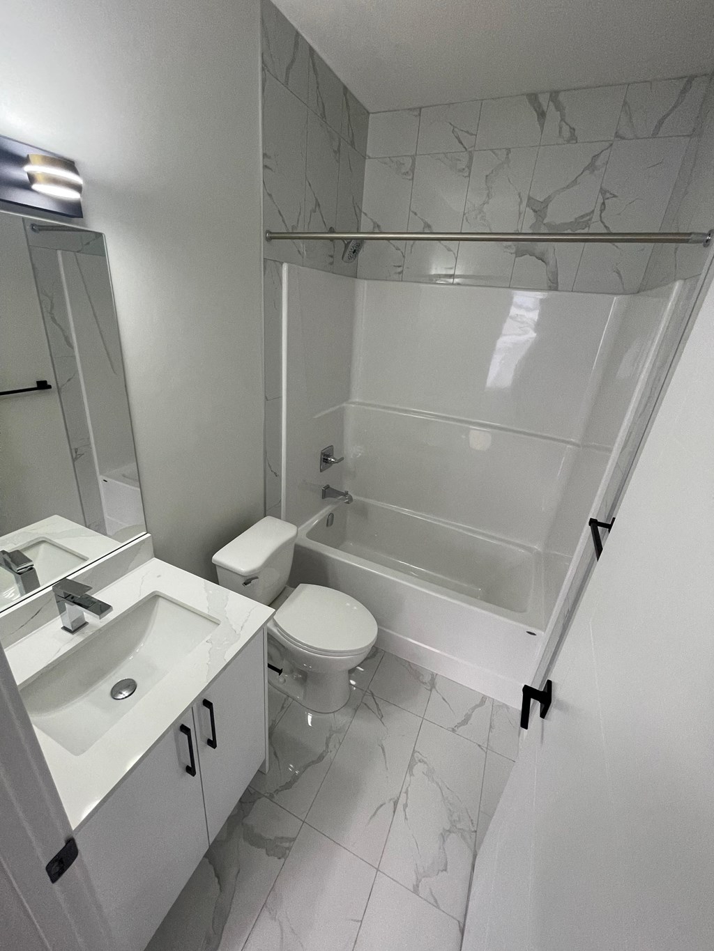 a bathroom with a sink toilet and a tub