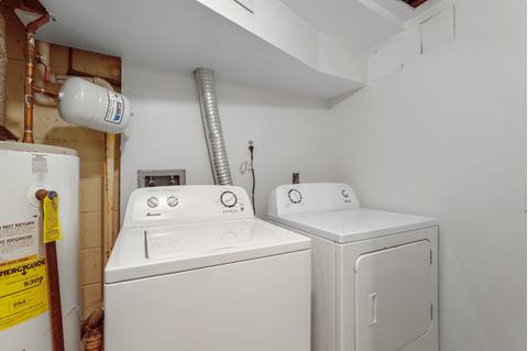 a washer and dryer in the laundry room of a house