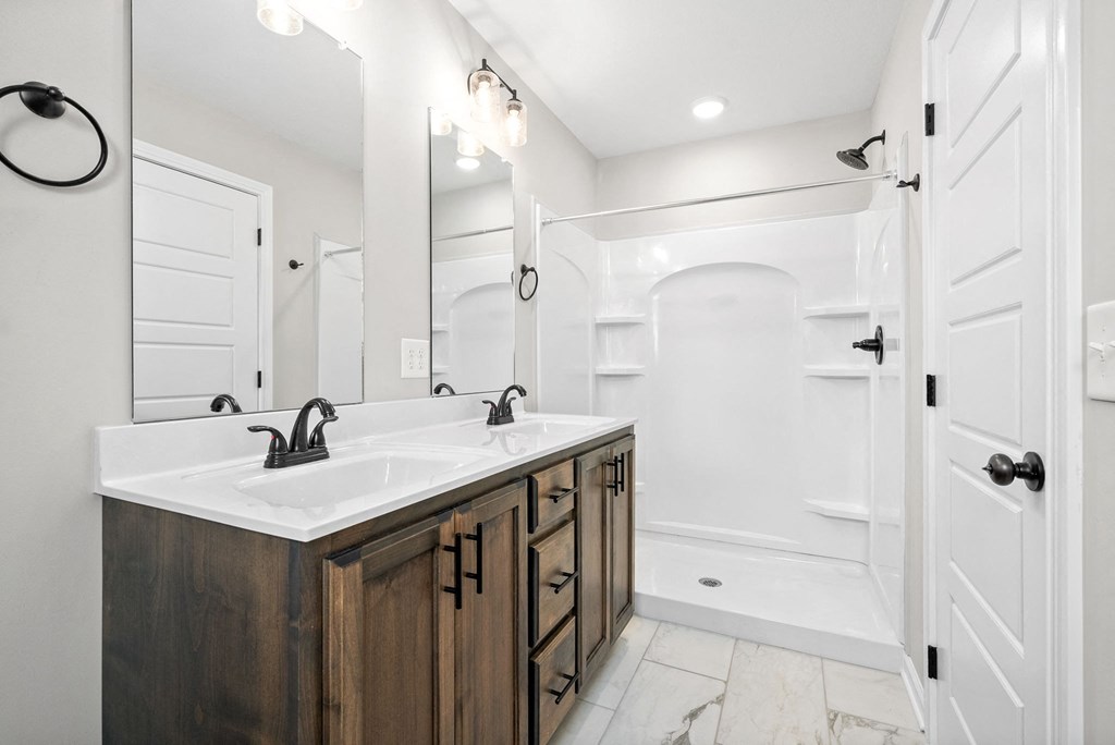 a bathroom with a sink and a shower