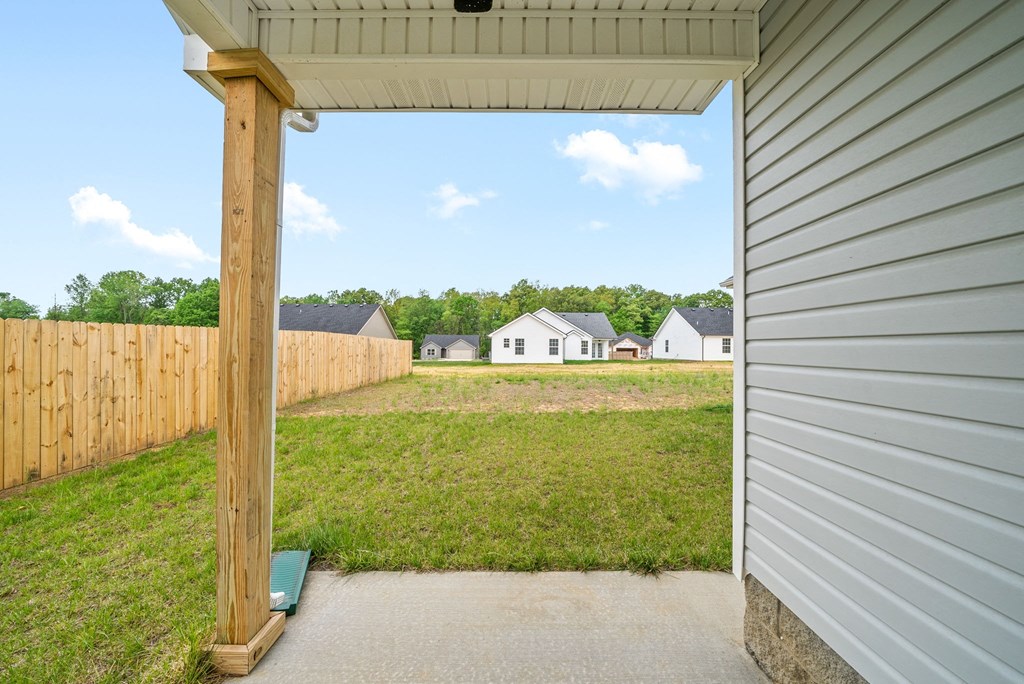 a view of a backyard from a garage door