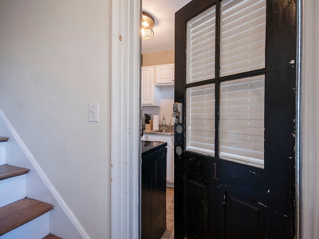 the view of the kitchen from the front door