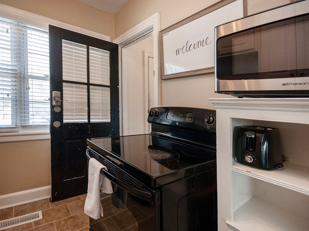 a kitchen with a stove and a microwave
