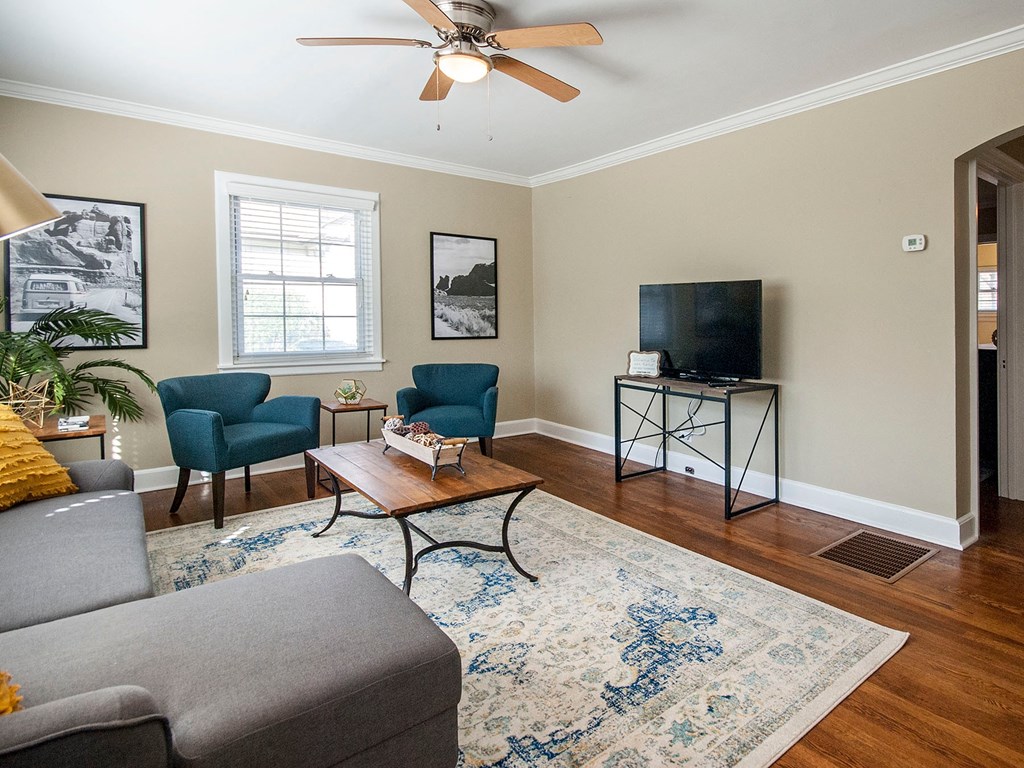 a living room with a couch and a tv