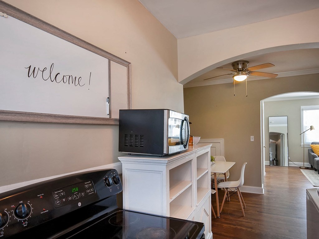 a kitchen with a television on top of a cabinet