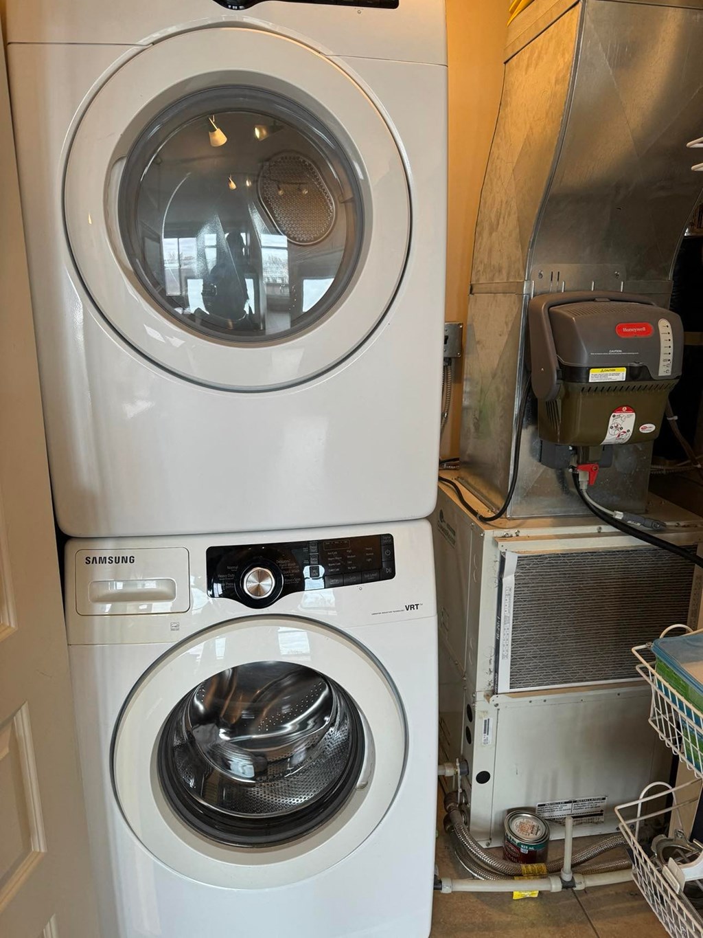 a washing machine and a dryer in a laundry room