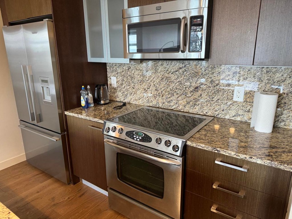 a kitchen with a stove and a microwave