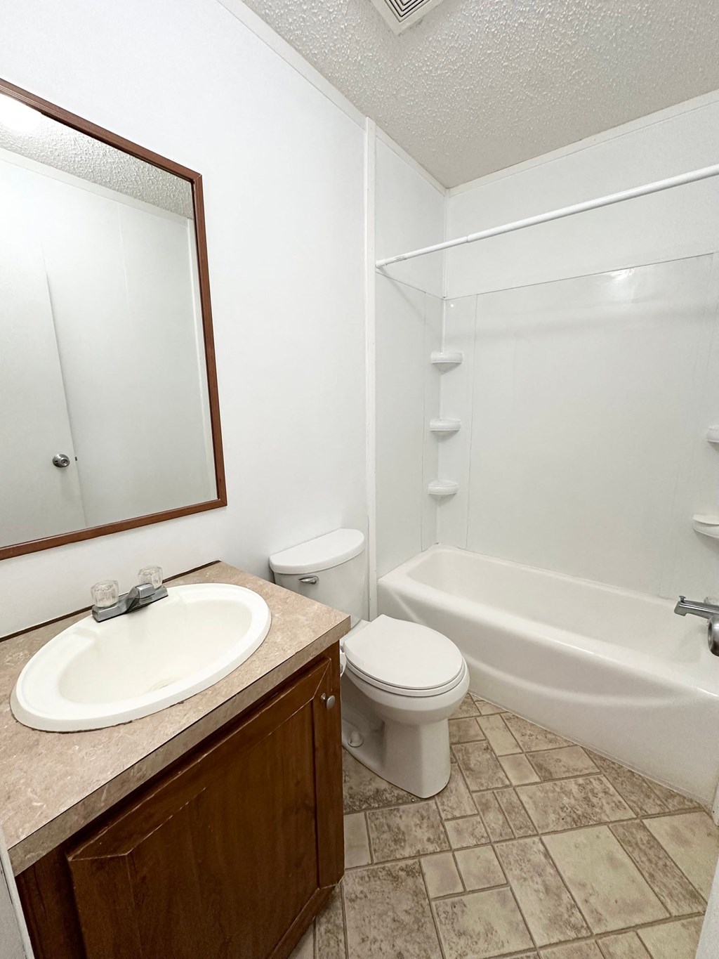 a bathroom with a sink toilet and a shower