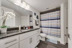 a bathroom with a toilet and a sink and a mirror