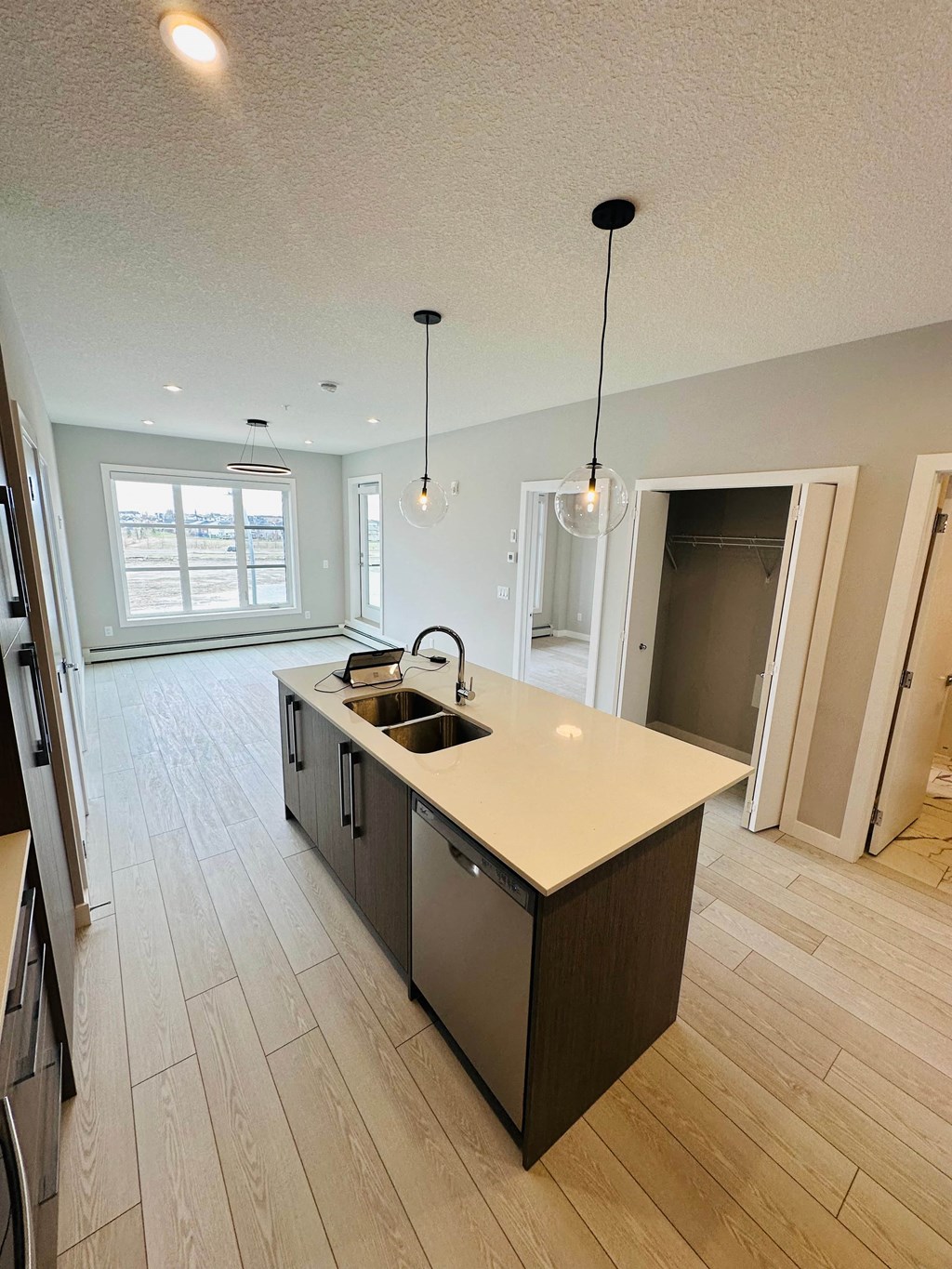 a kitchen with a center island and a sink
