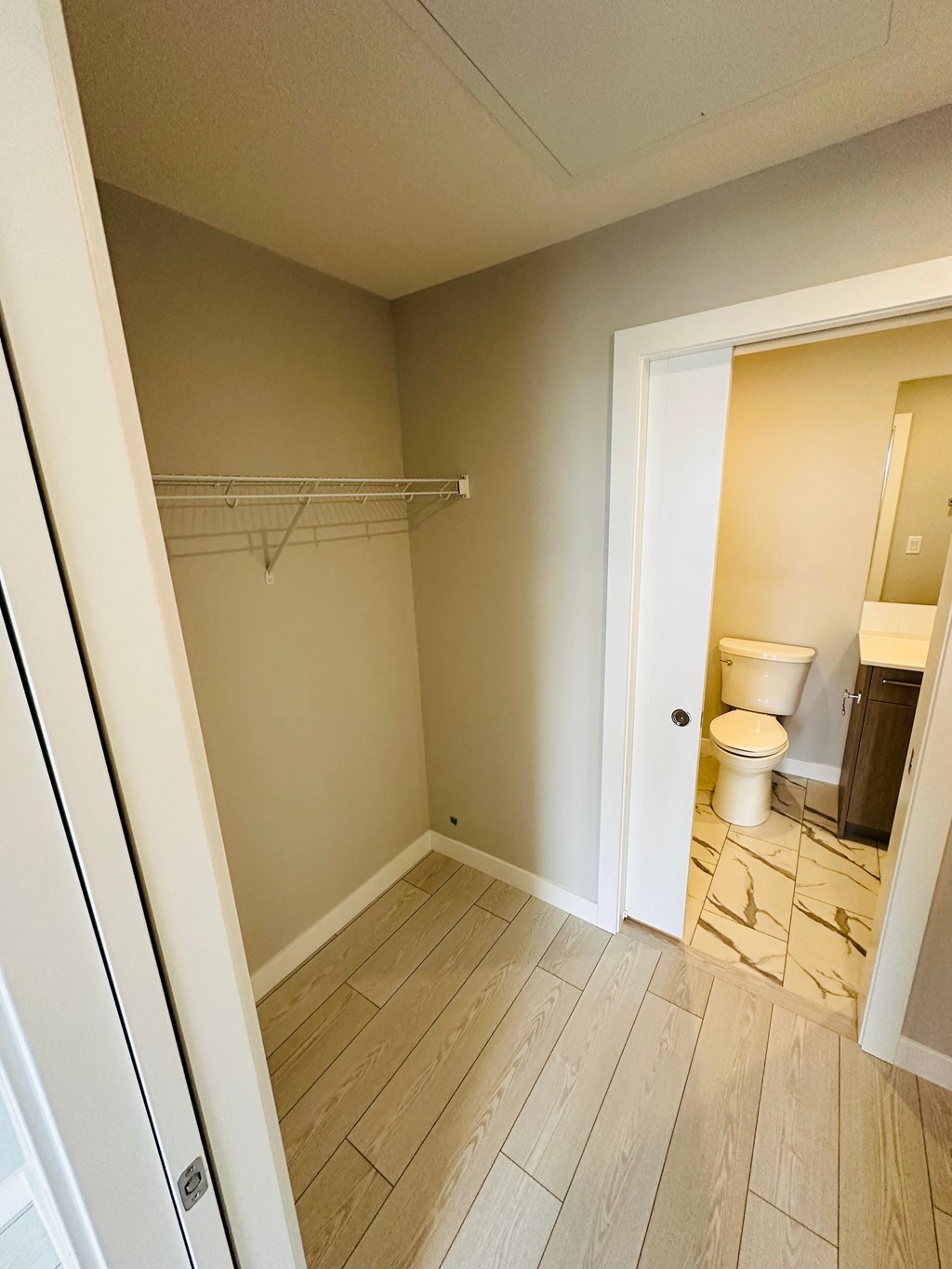 an empty bathroom with a toilet and a shower in it