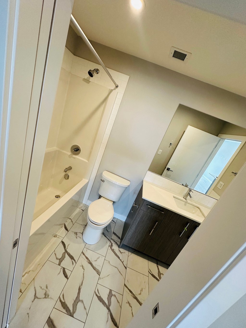 a bathroom with a toilet and a sink