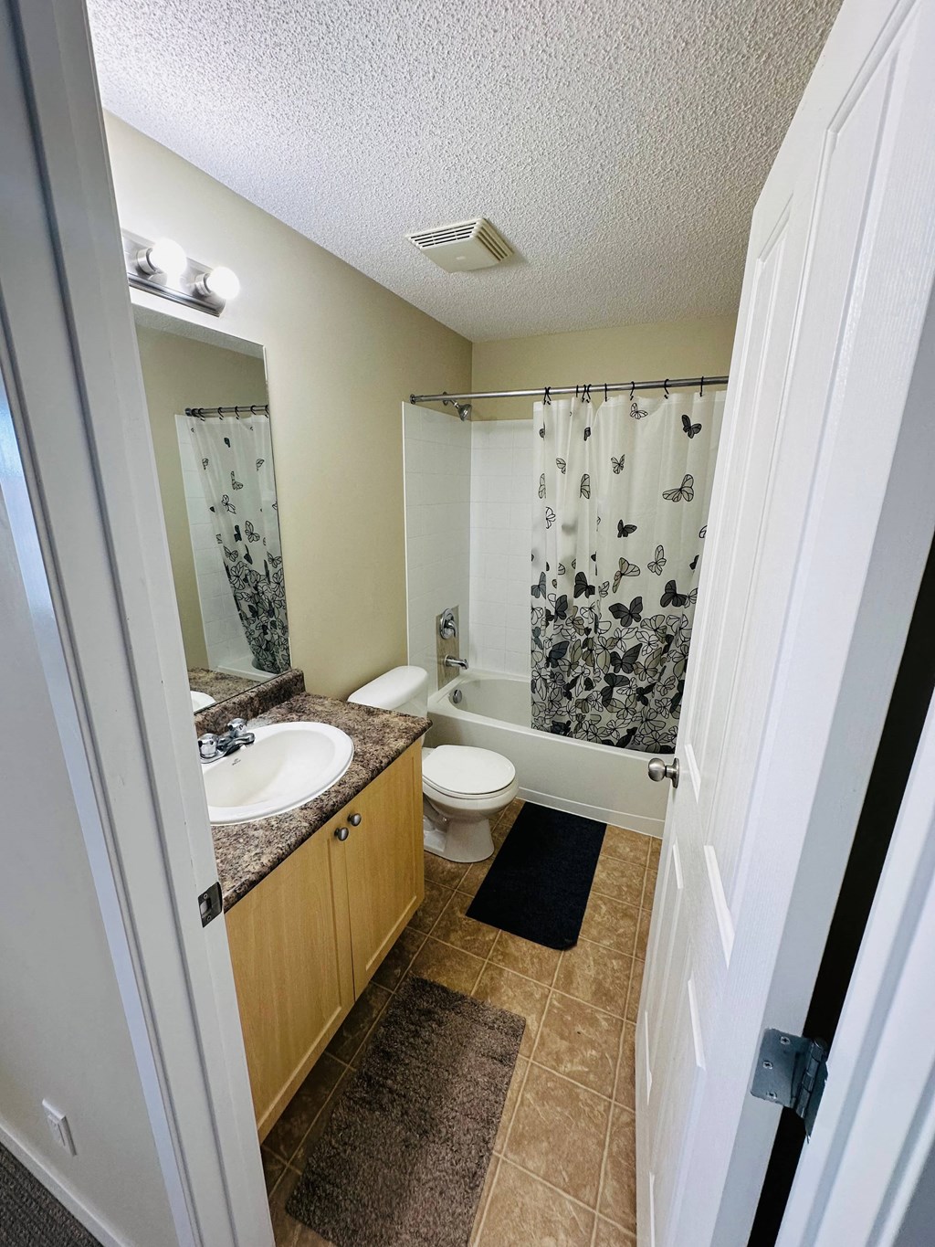 a bathroom with a sink toilet and a shower