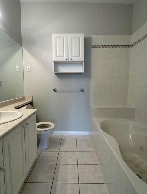 a bathroom with a sink toilet and a bath tub