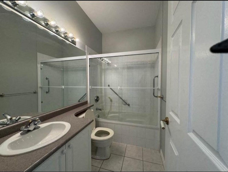 a bathroom with a sink toilet and a shower