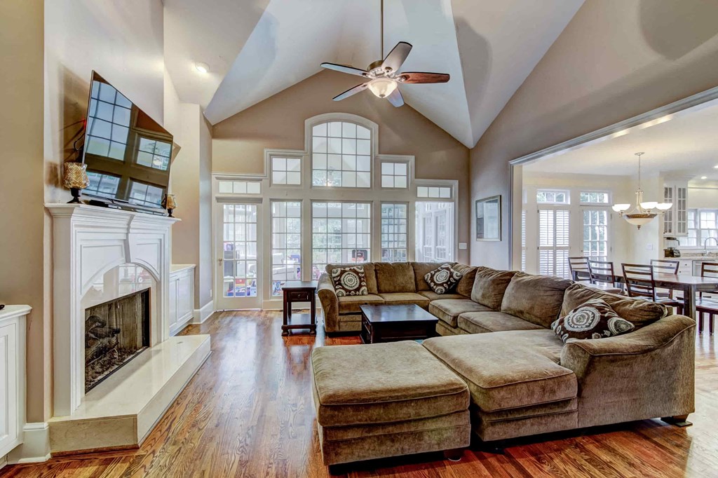 a large living room with a couch and a fireplace