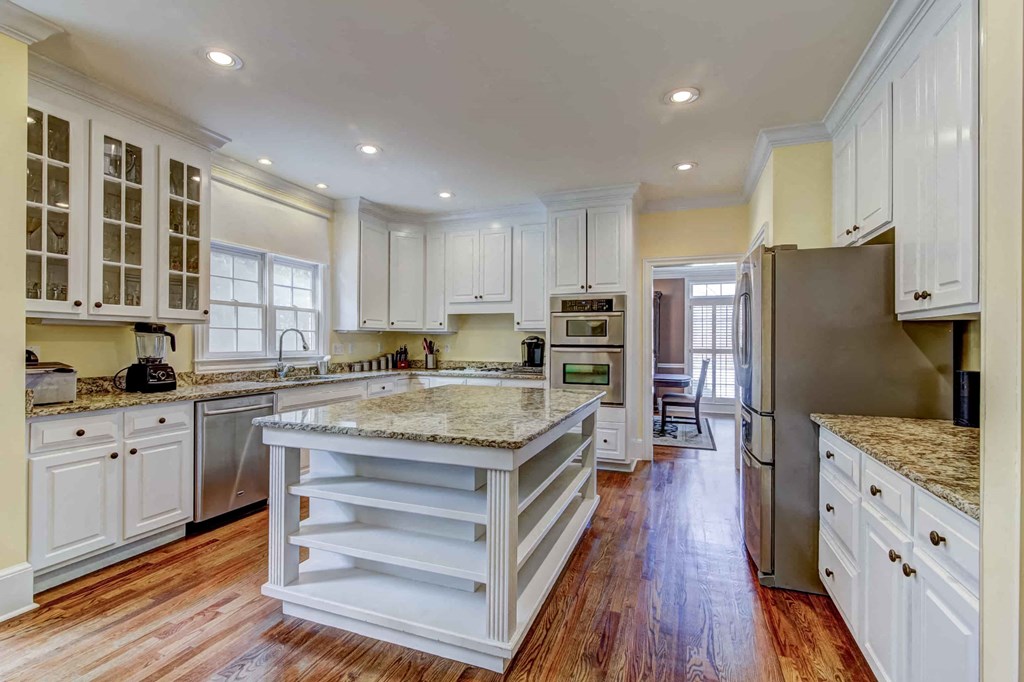 a kitchen with a large island in the middle