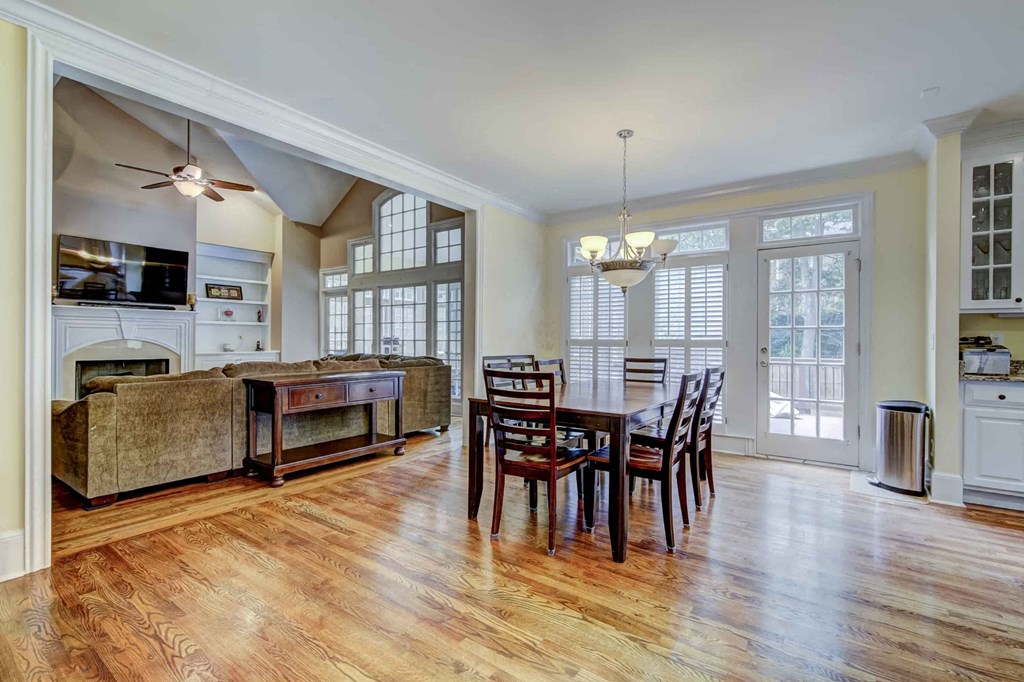 a large living room with a dining room table and a couch