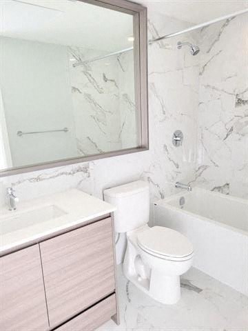 a bathroom with a toilet and a sink and a mirror