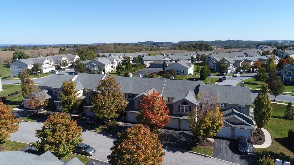 an aerial view of a neighborhood with houses and trees